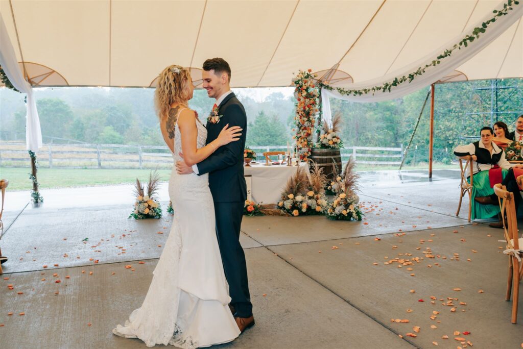Bride and groom having their first dance at their wedding reception at Robin Hills Farm in Chelsea Michigan