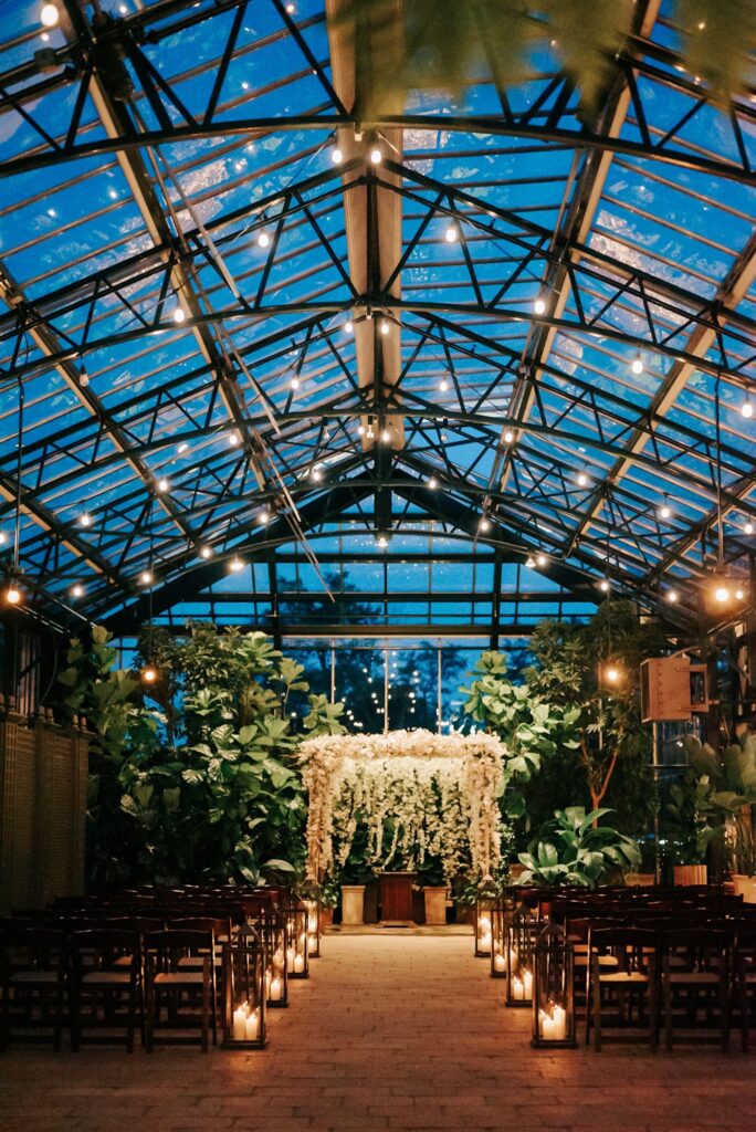 Beautiful nighttime wedding reception at Michigan wedding venue, Planterra Conservatory