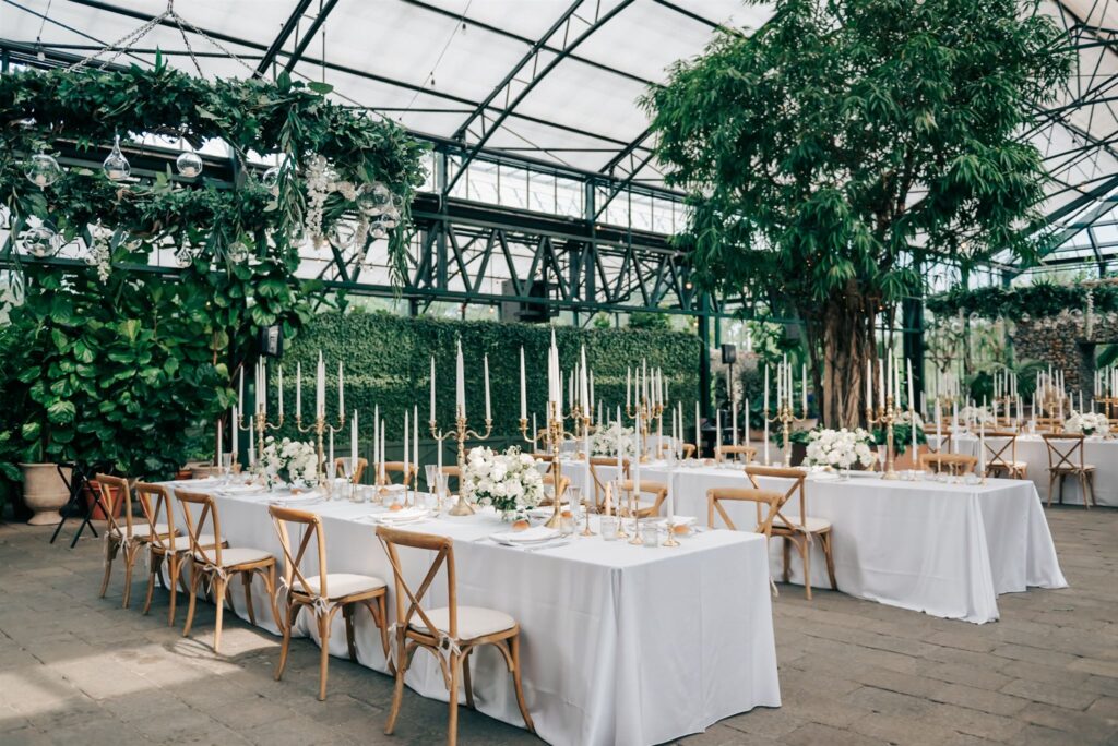 Wedding receiption with candles and white linens set up at Michigan Wedding Venue, Planterra Conservatory