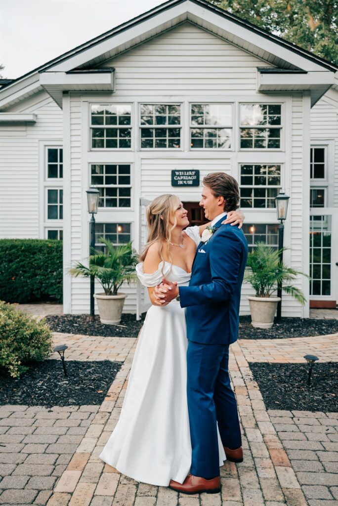 Bride and groom at exterior of Wellers Carriage House in Southeastern Michigan