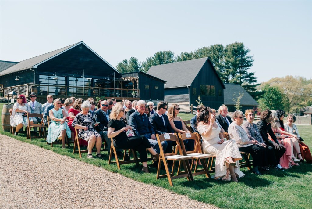 Wedding guests at wedding ceremony at Westers Vineyard in Michigan