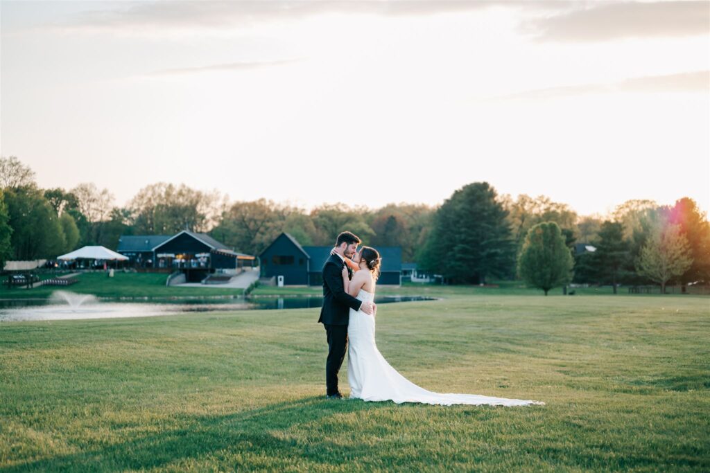 Bride and groom standing close together at sunset at Westers Vineyard in Michigan