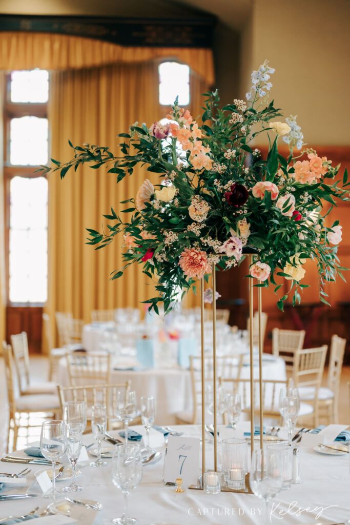 Flower arrangement on wedding reception table at Michigan League Ballroom