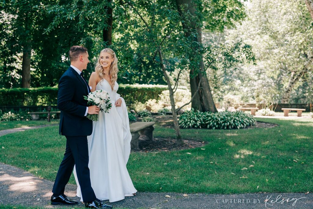 Couple walking on the grounds of Pine Knob Carriage House